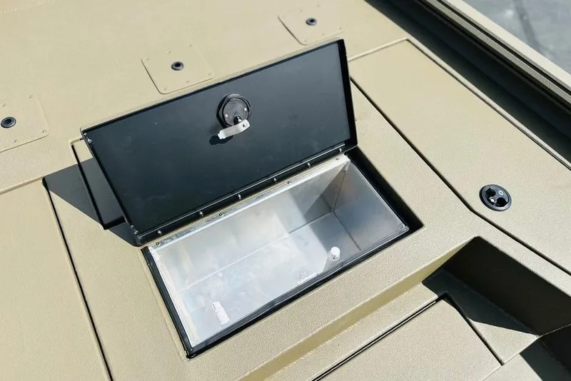 Slide: The Image of Open storage compartment on Thor 1900, 2026 model, with a black lid and beige surface. - 3