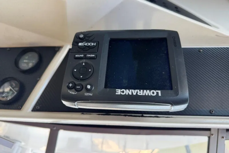 Slide: The Image of Lowrance fishfinder on 1989 Sea Ray 300 Sedan Bridge dashboard. - 16