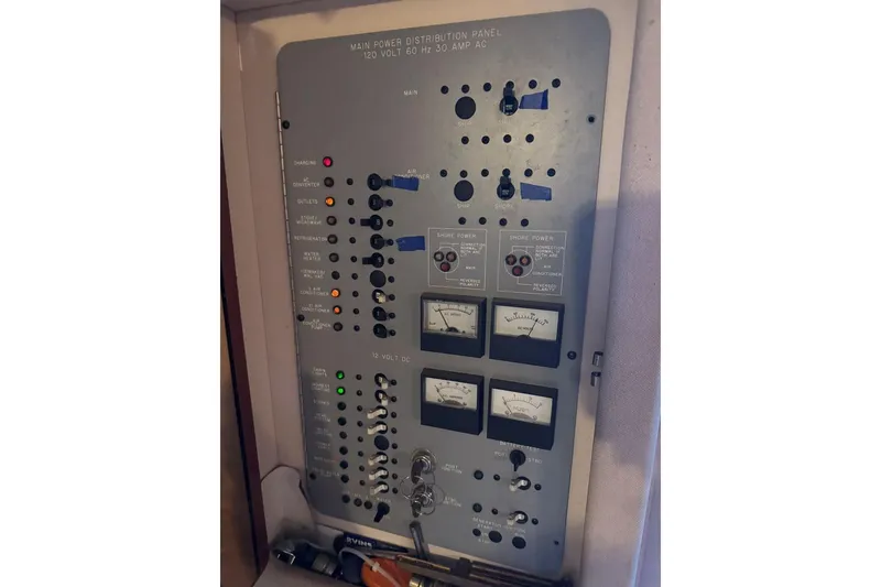 Slide: The Image of Main power distribution panel on 1989 Sea Ray 300 Sedan Bridge boat. - 26