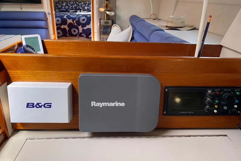 Slide: The Image of Navigation equipment on a 1995 Sundeer 56 yacht, featuring B&G and Raymarine systems. - 13