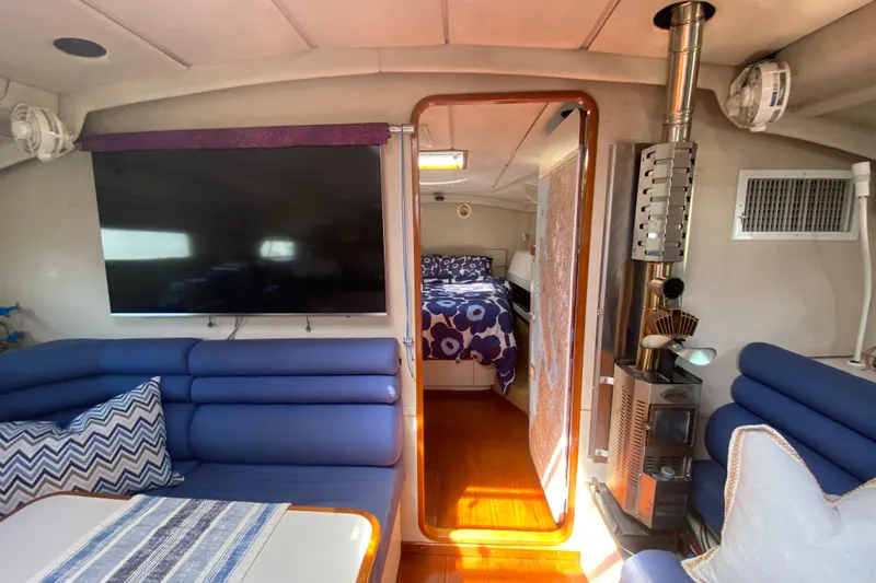 Slide: The Image of Interior of a 1995 Sundeer 56 yacht with cozy seating and modern amenities. - 17