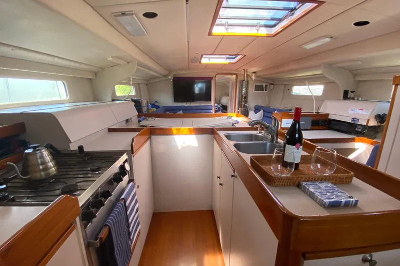 Slide: The Image of Interior of 1995 Sundeer 56 yacht with kitchen, wine, and seating area. - 2