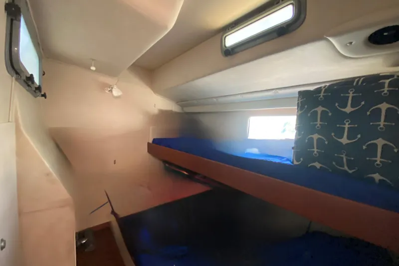 Slide: The Image of Interior of 1995 Sundeer 56 yacht with bunk beds and nautical-themed decor. - 22