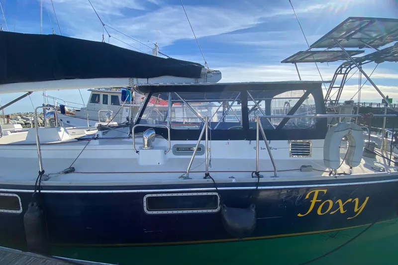 Slide: The Image of Sundeer 56 sailboat named "Foxy" docked at marina, 1995 model. - 33