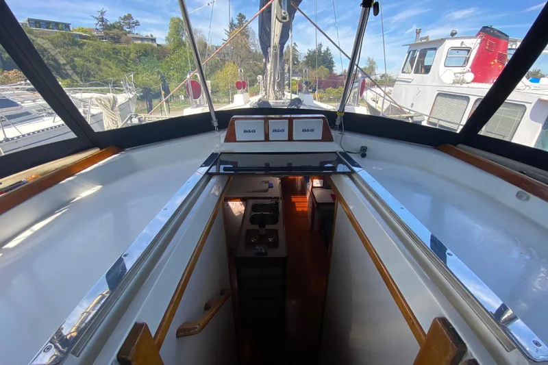 Slide: The Image of Interior view of a 1995 Sundeer 56 sailboat cockpit with navigation equipment. - 34