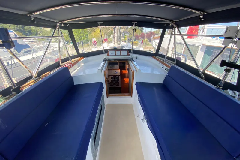 Slide: The Image of Interior view of a 1995 Sundeer 56 yacht with blue seating and navigation area. - 35