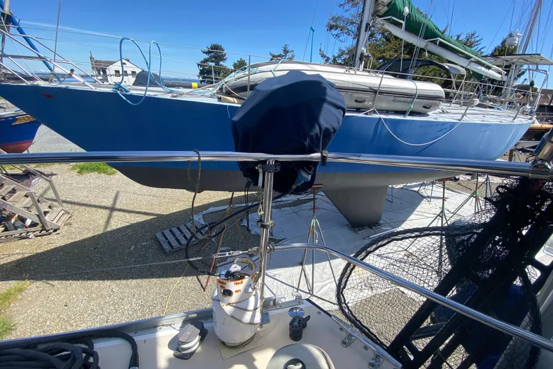 Slide: The Image of Sundeer 56 sailboat from 1995 on dry dock, blue hull, sunny day. - 39
