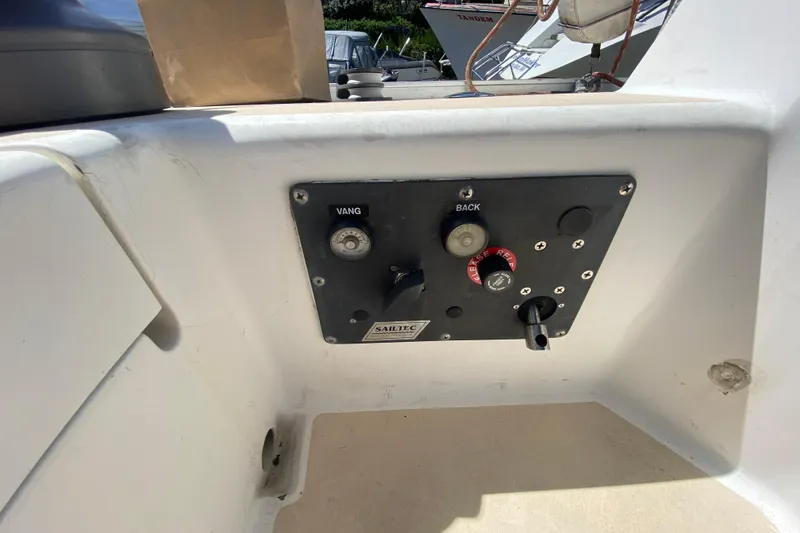 Slide: The Image of Control panel on a 1995 Sundeer 56 sailboat, featuring various switches and labels. - 40