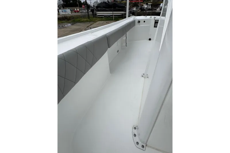 Slide: The Image of 2026 Blazer Bay 2440 boat interior with cushioned seating and sleek design. - 18