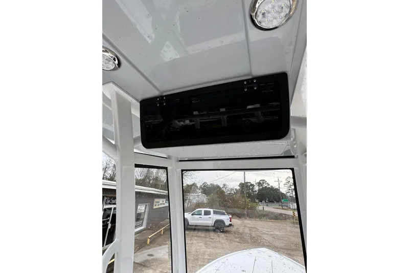 Slide: The Image of Interior view of 2026 Blazer Bay 2440 boat with overhead console and lighting. - 24