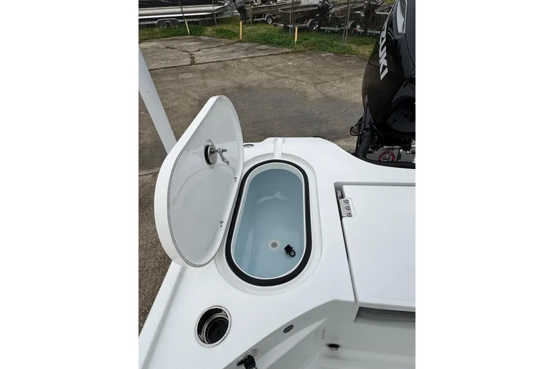Slide: The Image of Open storage compartment on 2026 Blazer Bay 2440 boat, featuring a clean white interior. - 27
