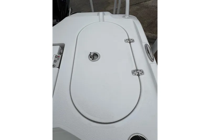 Slide: The Image of 2026 Blazer Bay 2440 boat deck with storage compartment and latch. - 33