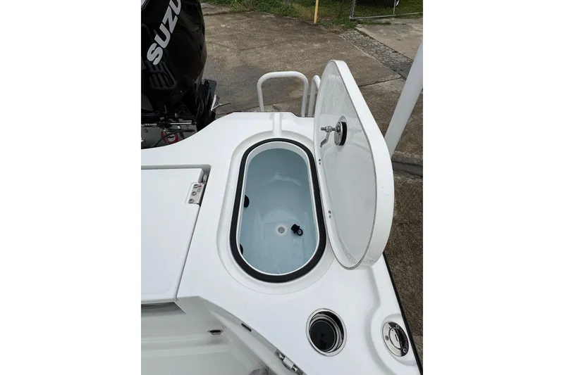 Slide: The Image of Open livewell on 2026 Blazer Bay 2440 boat with Suzuki engine. - 34