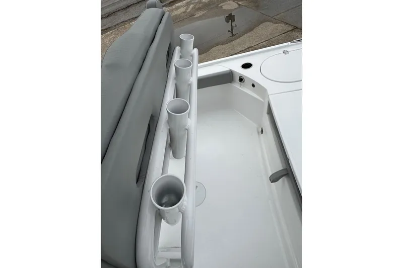 Slide: The Image of 2026 Blazer Bay 2440 boat interior with rod holders and seating. - 35