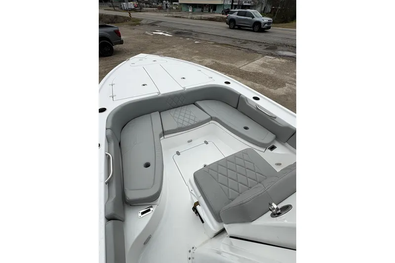 Slide: The Image of 2026 Blazer Bay 2440 boat interior with gray seating and storage compartments. - 38