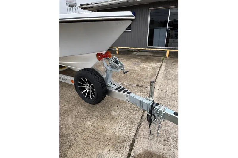 Slide: The Image of 2026 Blazer Bay 2440 boat on trailer, featuring sleek design and modern wheel. - 4