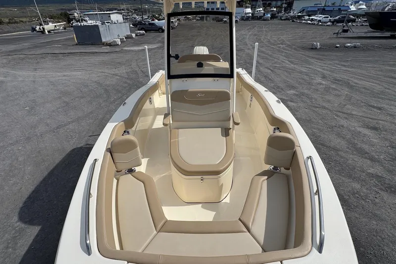 Slide: The Image of 2025 Scout 215 XSF boat interior with beige seating and spacious layout. - 14