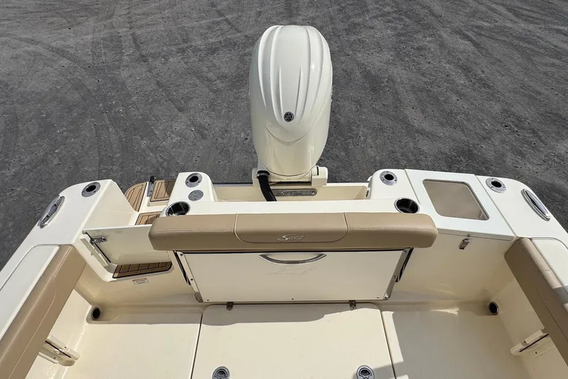 Slide: The Image of 2025 Scout 215 XSF boat interior with outboard motor and seating area. - 20