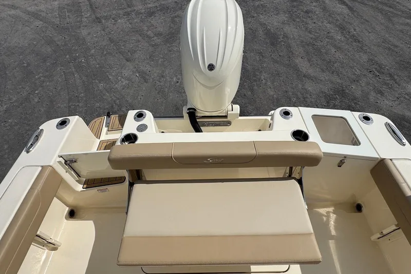 Slide: The Image of 2025 Scout 215 XSF boat interior with seating and motor, top view. - 21