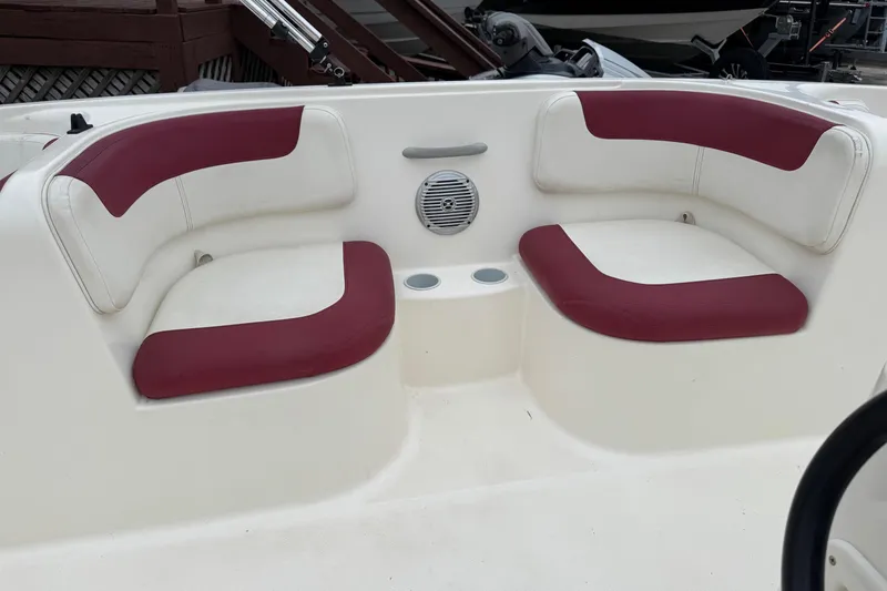 Slide: The Image of 2015 Bayliner Element 180 XL boat interior with red and white seating. - 13