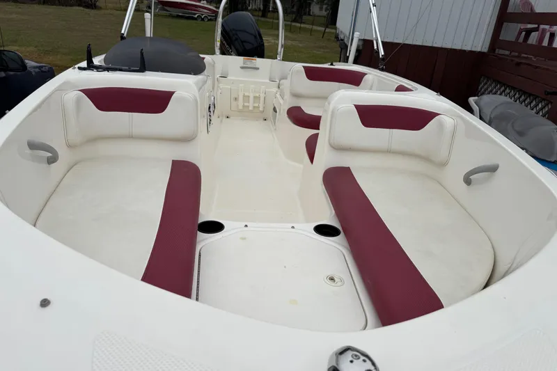 Slide: The Image of 2015 Bayliner Element 180 XL boat interior with red and white seating. - 14