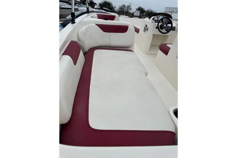 Slide: The Image of 2015 Bayliner Element 180 XL boat interior with red and white seating. - 6