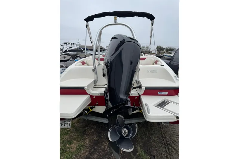 Slide: The Image of 2015 Bayliner Element 180 XL boat, rear view with outboard motor and swim platform. - 7