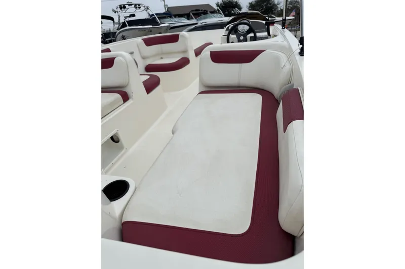 Slide: The Image of 2015 Bayliner Element 180 XL boat interior with white and red seating. - 8