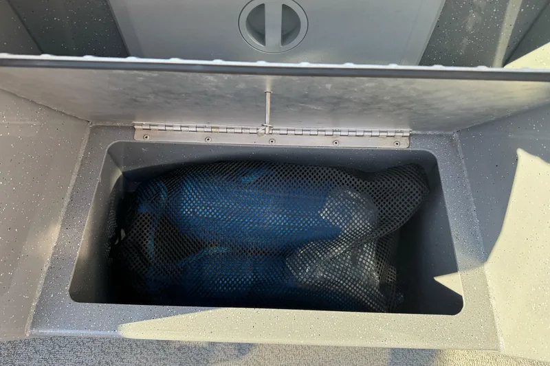 Slide: The Image of Storage compartment in 2017 RH Boats 18 SH, featuring a mesh bag inside. - 10