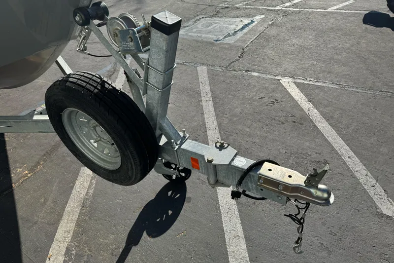 Slide: The Image of Trailer hitch of a 2017 RH Boats 18 SH in a parking lot. - 3