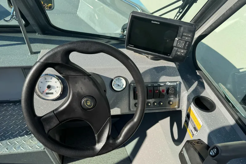 Slide: The Image of Steering console of 2017 RH Boats 18 SH with Garmin GPS and gauges. - 8