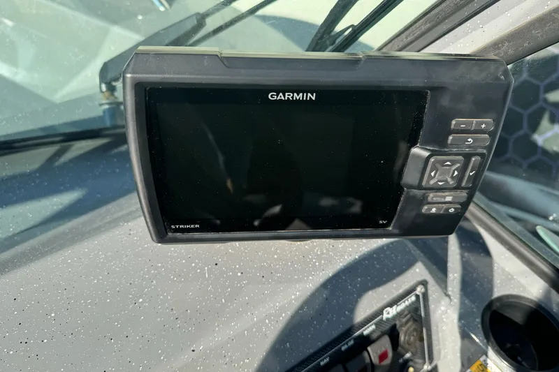 Slide: The Image of Garmin Striker fishfinder on 2017 RH Boats 18 SH dashboard. - 9