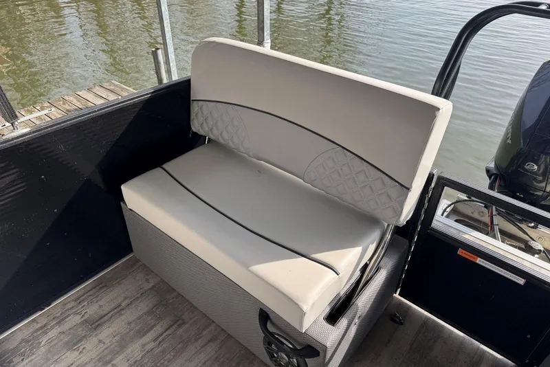 Slide: The Image of 2022 Crest Classic Platinum 220 SLRC boat seat with quilted design by the water. - 18