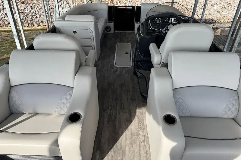 Slide: The Image of 2022 Crest Classic Platinum 220 SLRC interior with luxurious seating and modern dashboard. - 19