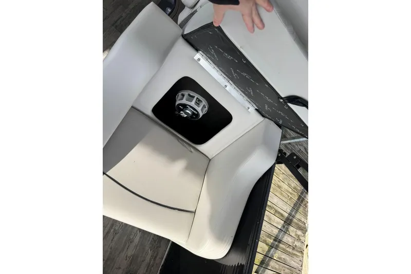 Slide: The Image of 2022 Crest Classic Platinum 220 SLRC boat seat with storage compartment open. - 23