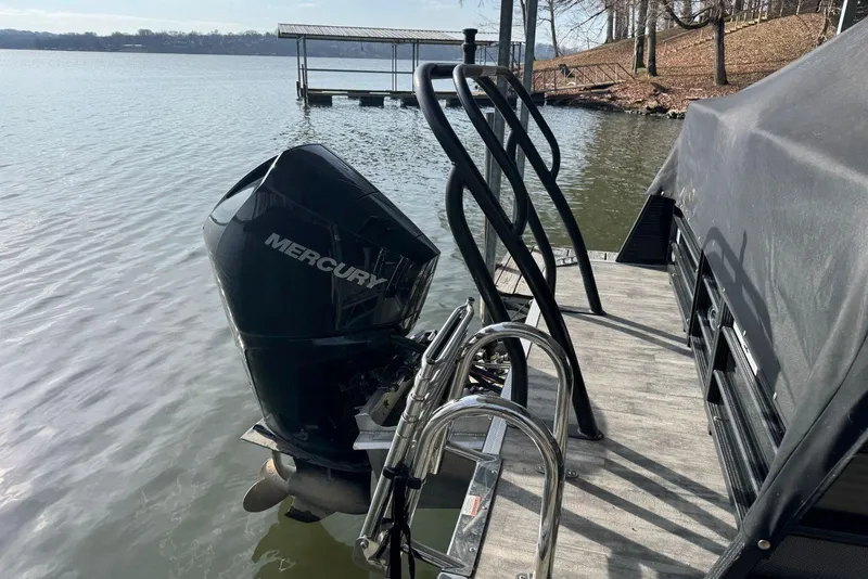 Slide: The Image of 2022 Crest Classic Platinum 220 SLRC with Mercury outboard motor on a lake. - 3