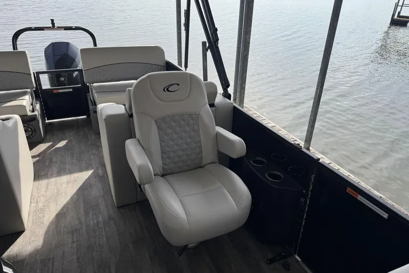 Slide: The Image of 2022 Crest Classic Platinum 220 SLRC pontoon boat interior with luxurious seating. - 8