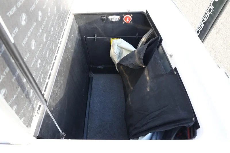 Slide: The Image of Storage compartment of 2016 Tigé R22 boat, featuring interior details and equipment. - 26