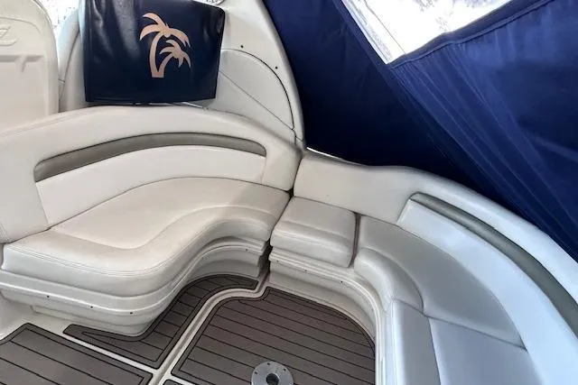 Slide: The Image of 2007 Sea Ray 340 Sundancer interior with white seating and blue canopy. - 10