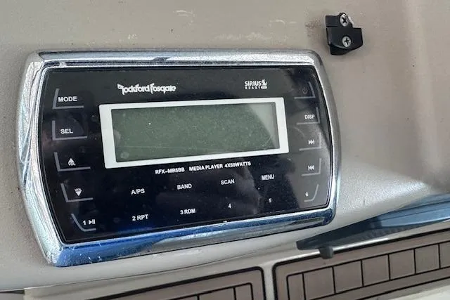 Slide: The Image of Rockford Fosgate media player on 2007 Sea Ray 340 Sundancer boat dashboard. - 16