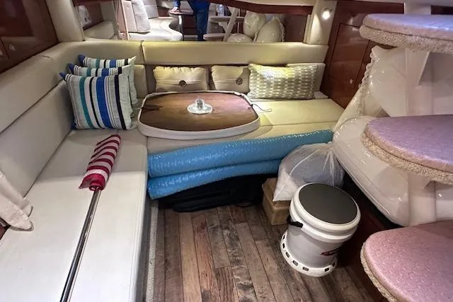 Slide: The Image of Interior of 2007 Sea Ray 340 Sundancer with cozy seating and nautical decor. - 22