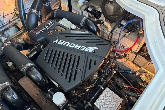 Slide: The Image of Engine compartment of 2007 Sea Ray 340 Sundancer with Mercury engine components. - 27