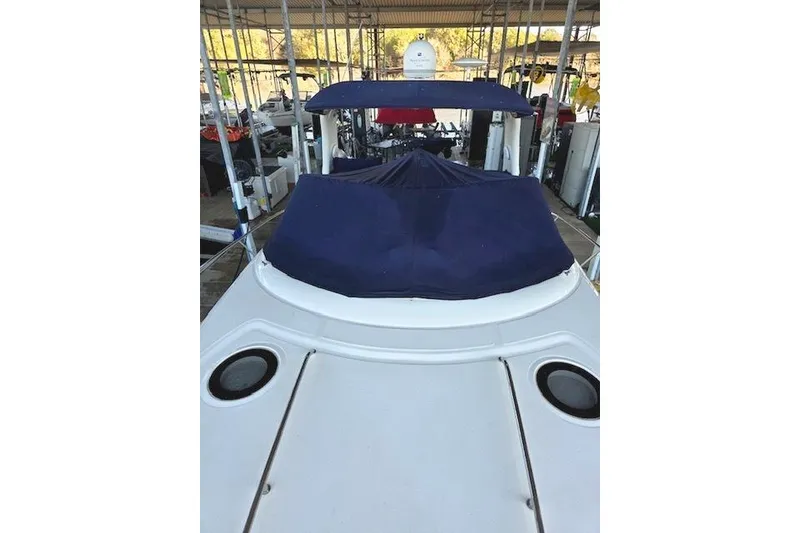 Slide: The Image of 2007 Sea Ray 340 Sundancer boat with blue cover in marina. - 33