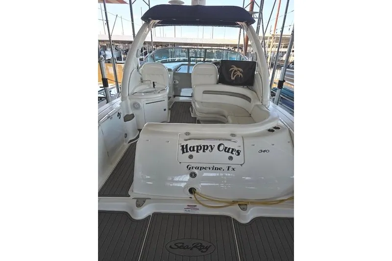 Slide: The Image of 2007 Sea Ray 340 Sundancer boat interior with seating, named "Happy Ours," docked in Grapevine, TX. - 34