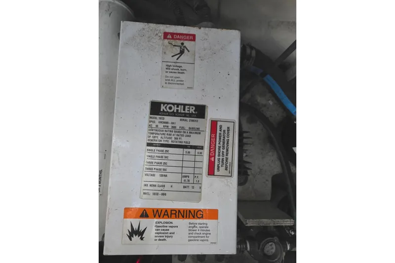 Slide: The Image of Kohler generator warning labels on a 2007 Sea Ray 340 Sundancer boat. - 38