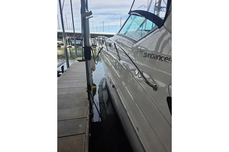 Slide: The Image of 2007 Sea Ray 340 Sundancer docked at marina, side view. - 47