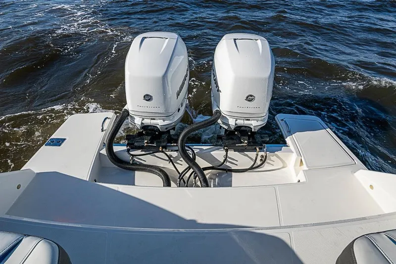 Slide: The Image of 2022 Tiara Yachts 34 LX with dual Mercury outboard engines on water. - 23