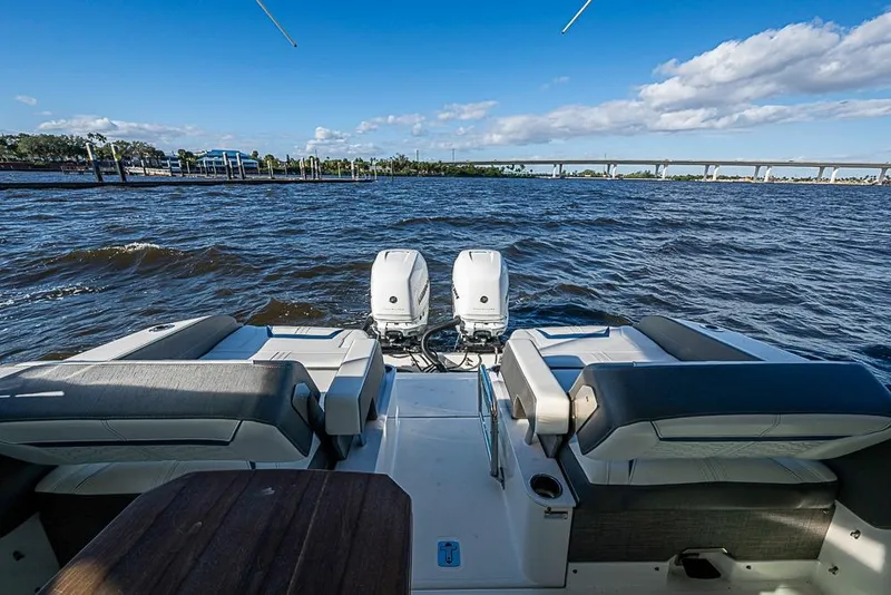 Slide: The Image of 2022 Tiara Yachts 34 LX interior with luxurious seating on a sunny day. - 25