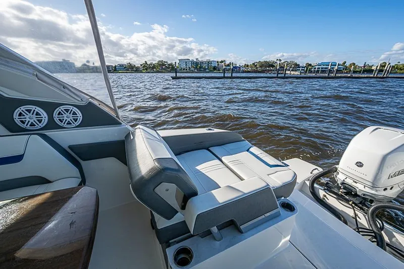 Slide: The Image of 2022 Tiara Yachts 34 LX on water, featuring dual engines and comfortable seating. - 26