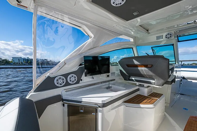 Slide: The Image of 2022 Tiara Yachts 34 LX interior storage compartment, sleek white design. - 30